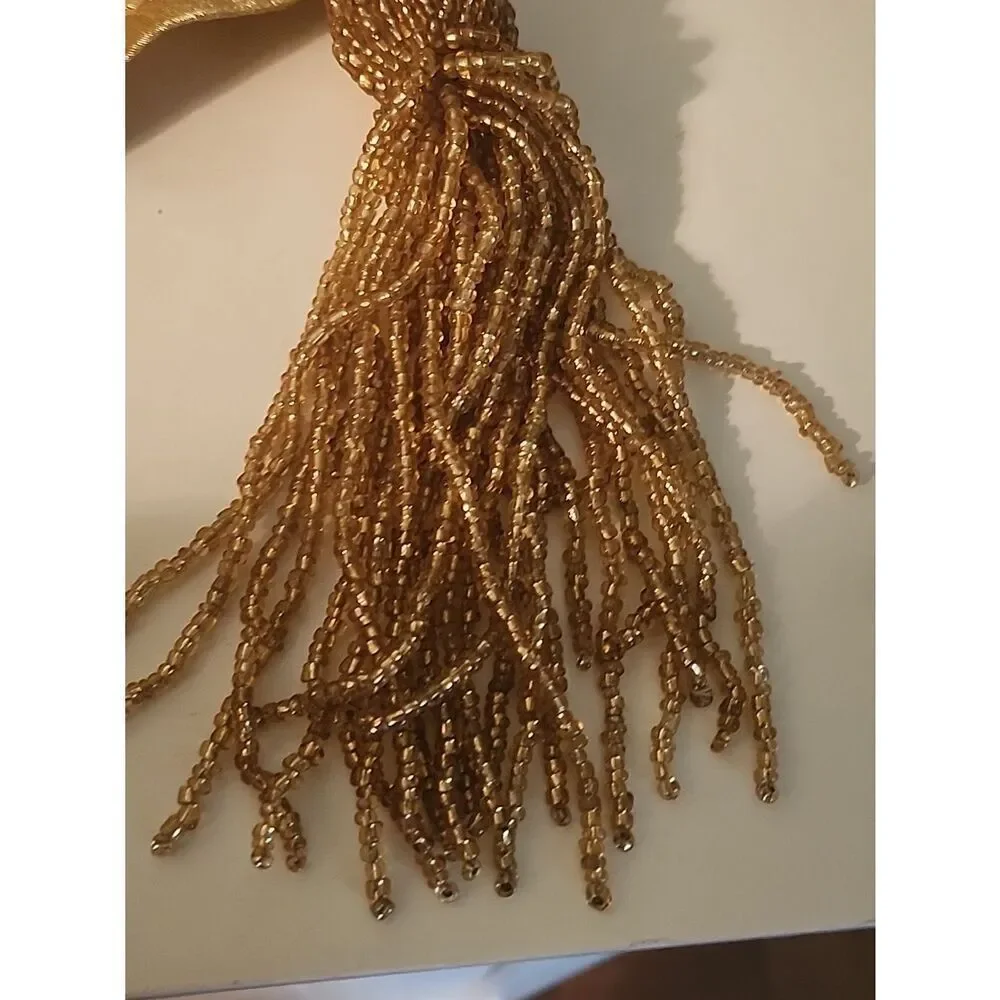 Gold Embrodiered Table Runner With Beaded Tassels.
